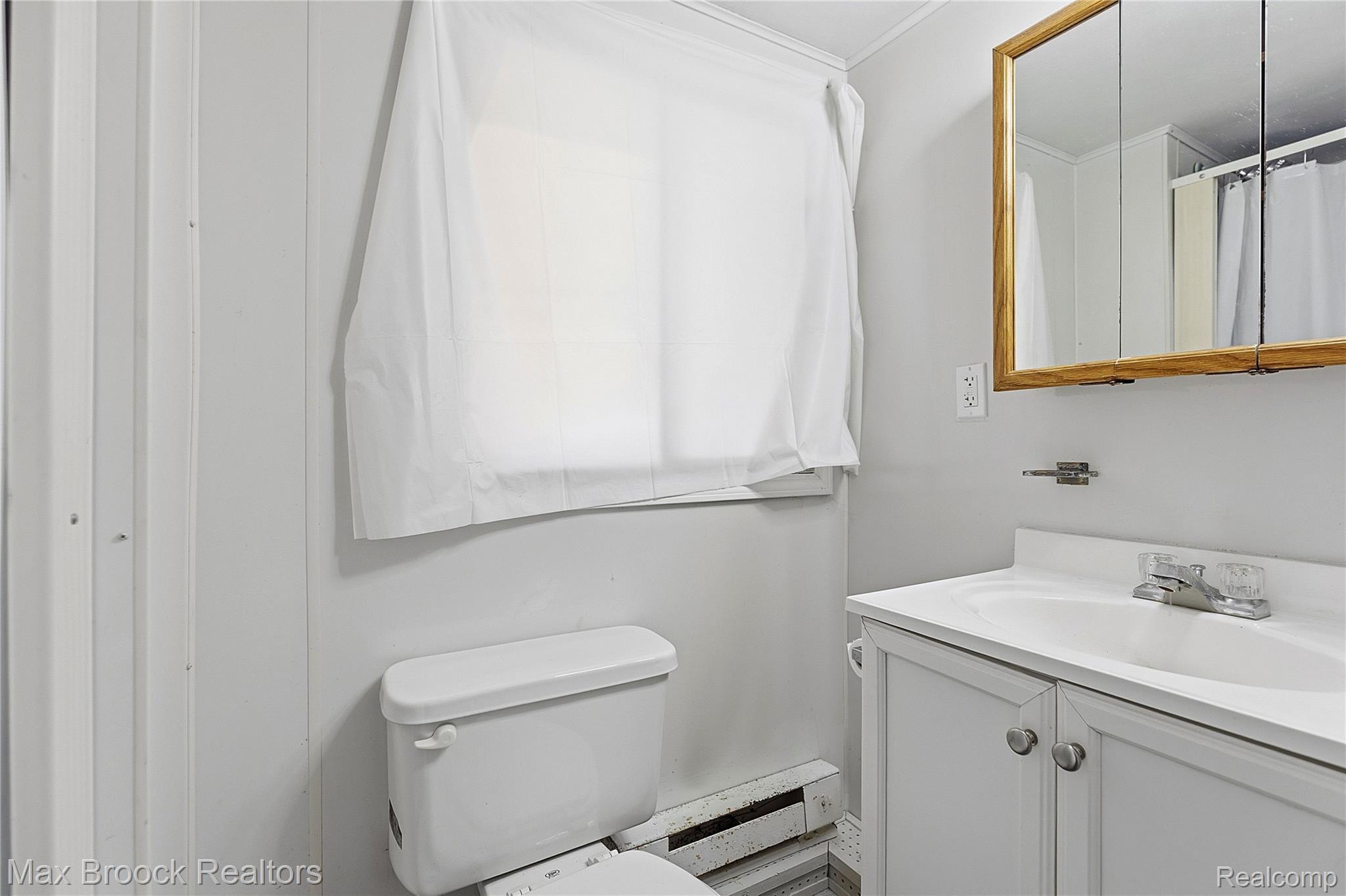 1392 Maple Grove Road Lapeer, MI 48446 - Photo 33 of 70 Bathroom with vanity and a shower with shower curtain