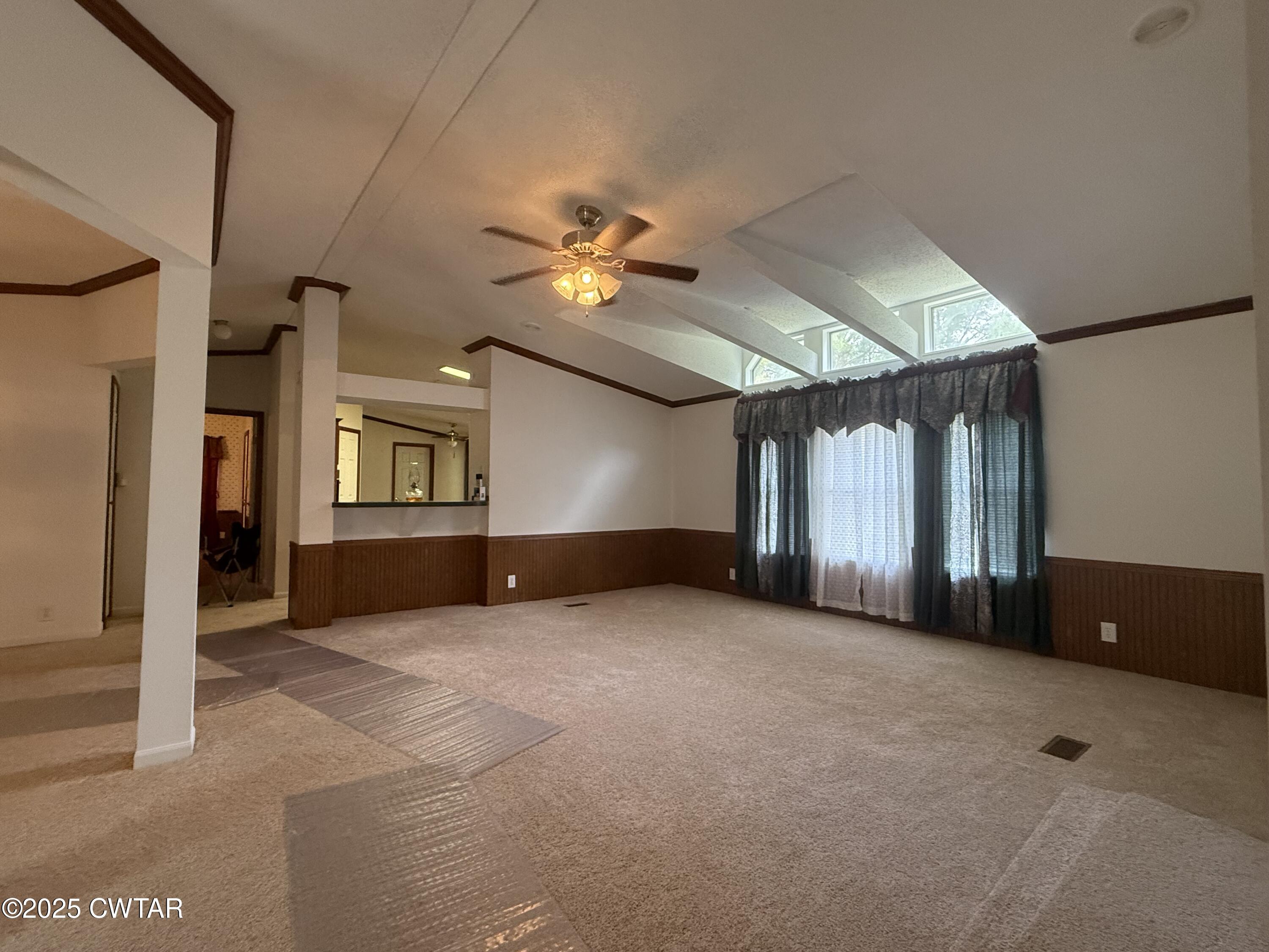 501 Post Office Road Michie, TN 38357 - Photo 13 of 20 an empty room with windows and ceiling fan