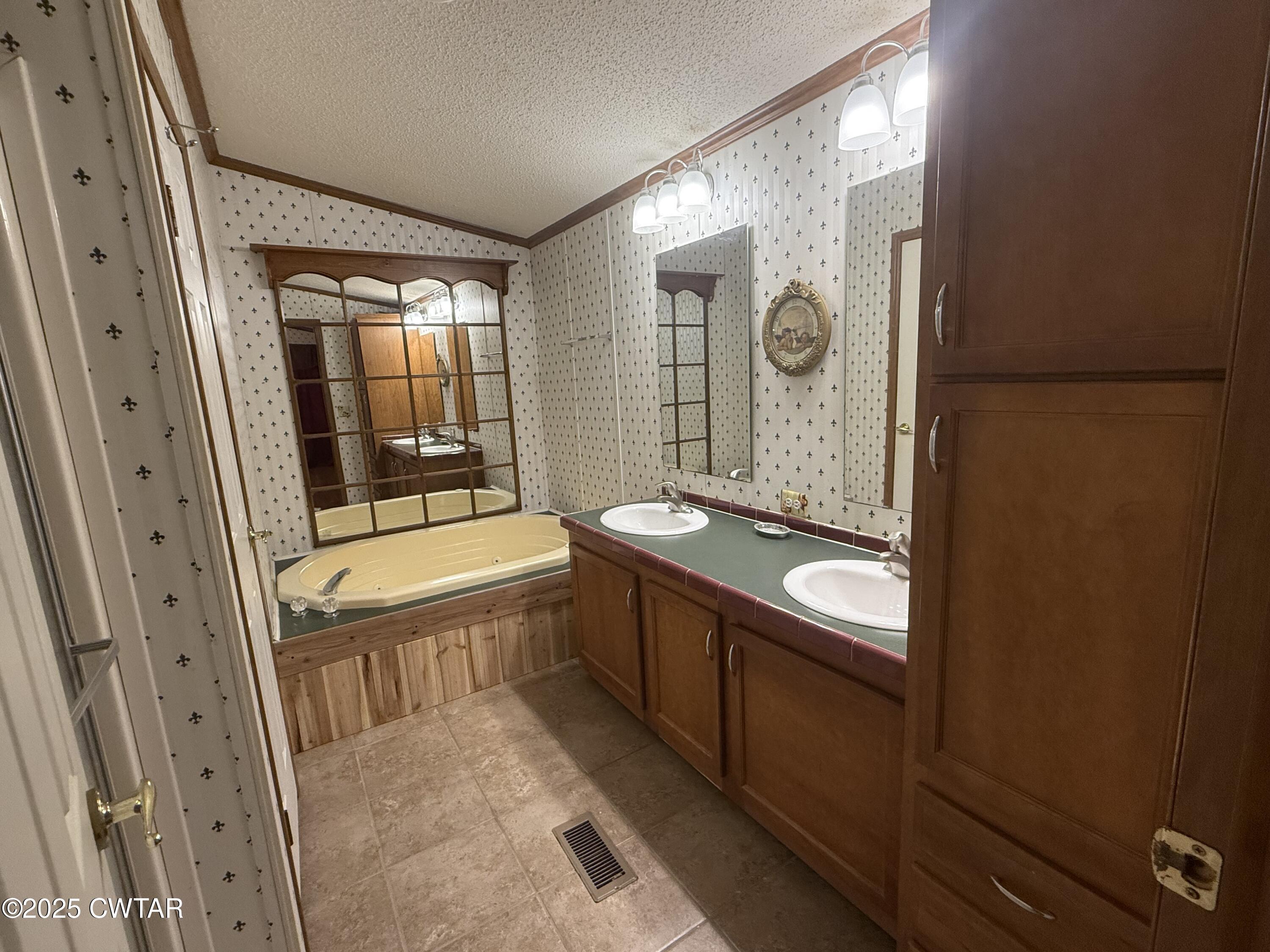 501 Post Office Road Michie, TN 38357 - Photo 17 of 20 a bathroom with a granite countertop sink a mirror and a bathtub