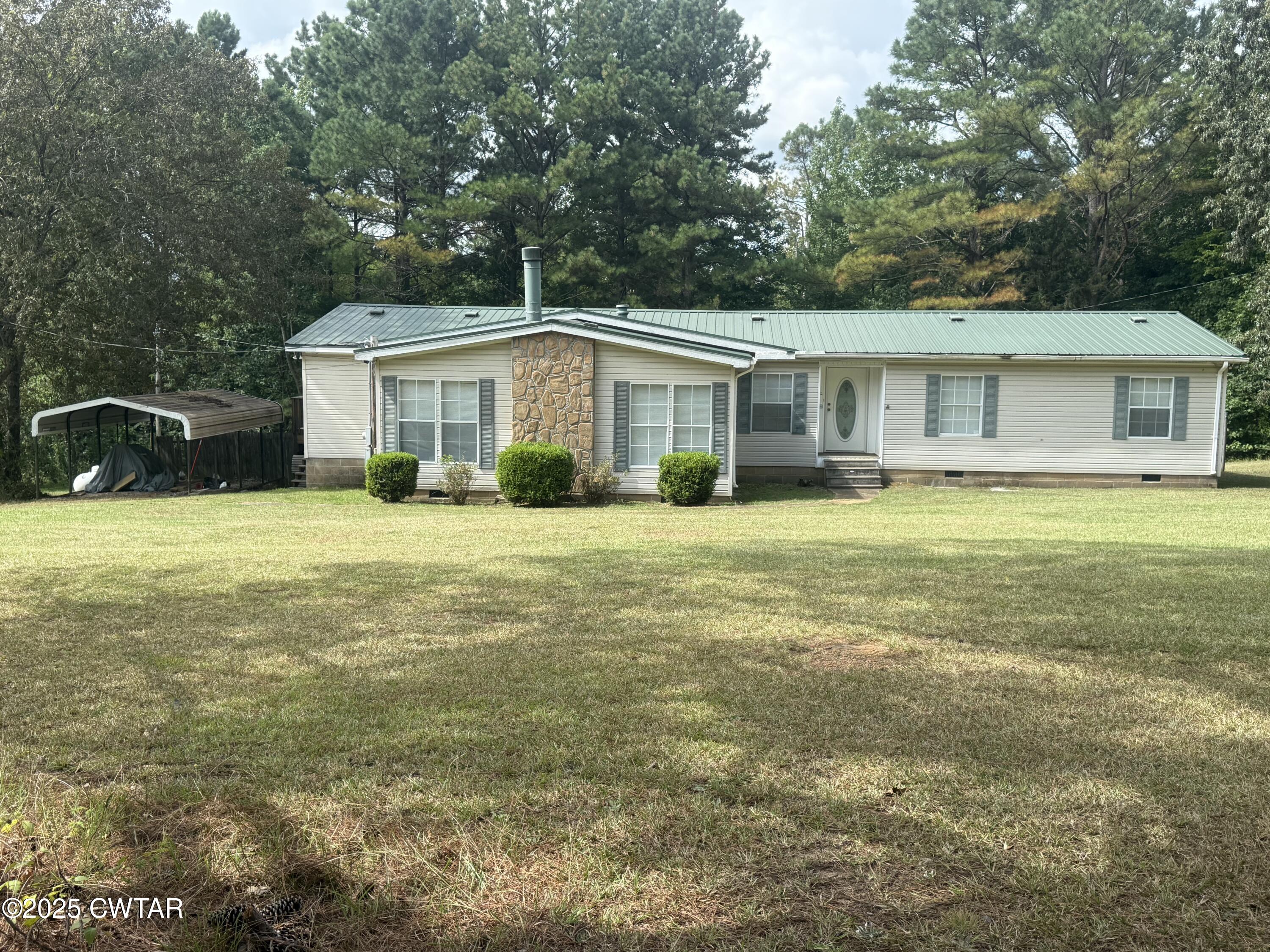 501 Post Office Road Michie, TN 38357 - Photo 2 of 20 a view of a house with yard and sitting area