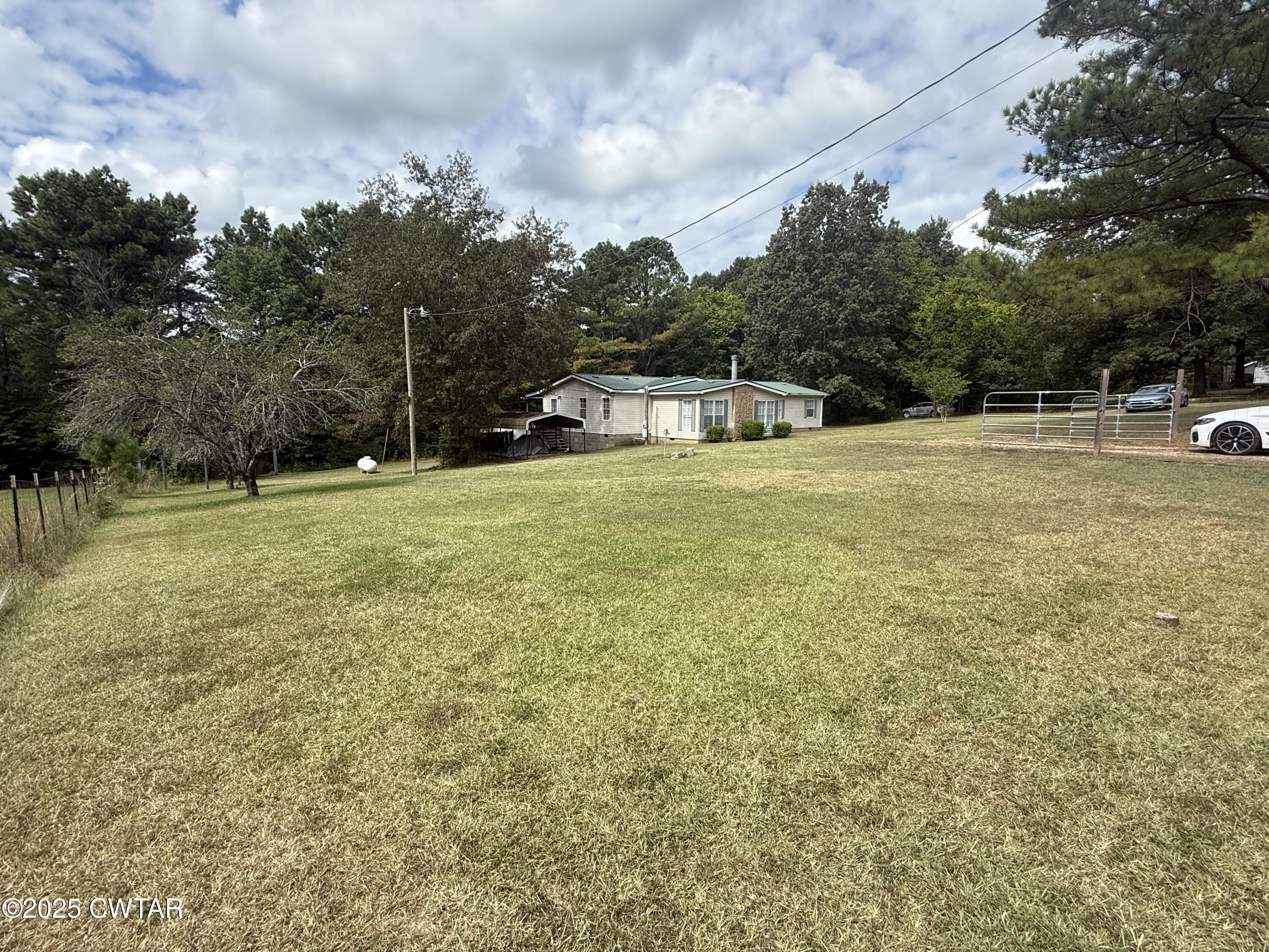 501 Post Office Road Michie, TN 38357 - Photo 5 of 20 a swimming pool is sitting in the middle of a lake