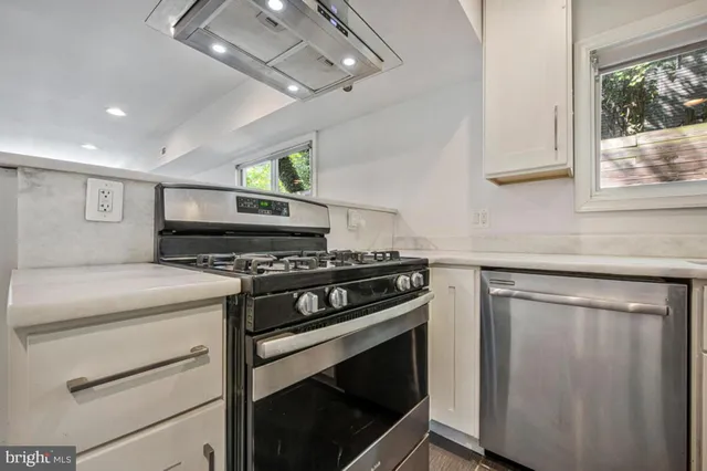 a kitchen with a stove and a sink