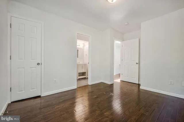 an empty room with wooden floor