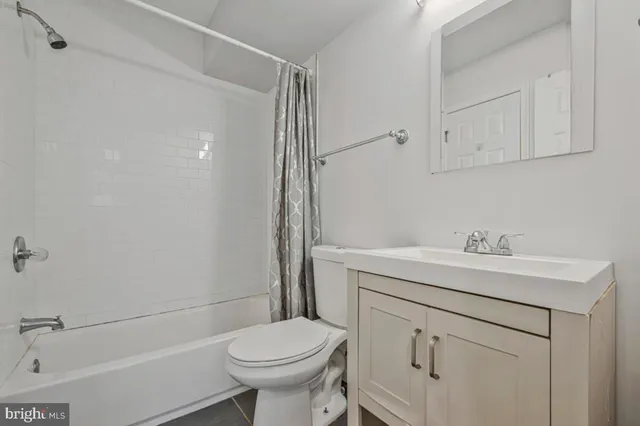 a bathroom with a sink toilet and vanity