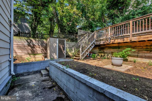 a view of a wooden deck with a yard