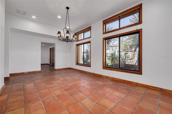 a view of an empty room and a windows