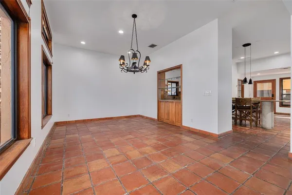 a view of an empty room with a fireplace