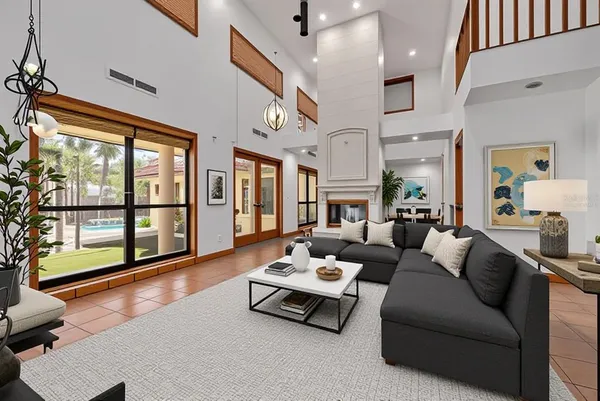 a view of an entryway with a fireplace and windows