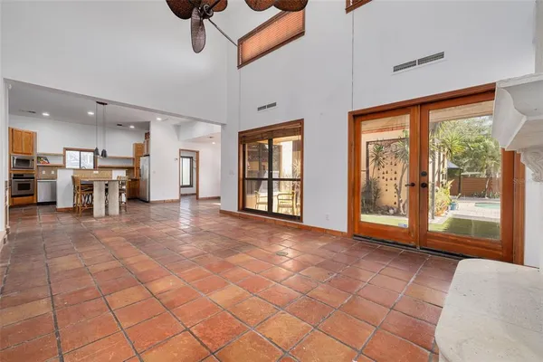 a kitchen with stainless steel appliances granite countertop a sink and a refrigerator