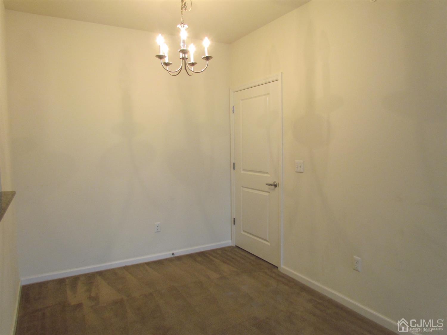746 Strassle Way South Plainfield, NJ 07080 - Photo 8 of 25 a view of a chandelier in big room
