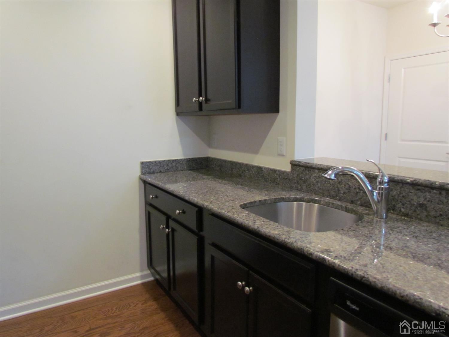 746 Strassle Way South Plainfield, NJ 07080 - Photo 10 of 25 a kitchen with a sink and cabinets
