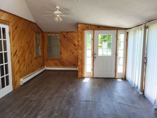 22 Pine Street Leicester, MA 01524 - Photo 2 of 13 a view of an empty room with a window and wooden floor