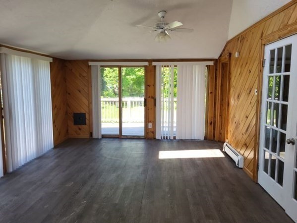 22 Pine Street Leicester, MA 01524 - Photo 3 of 13 an empty room with wooden floor and windows