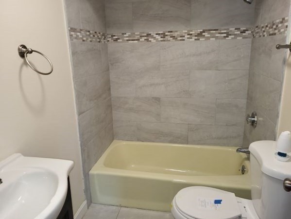 22 Pine Street Leicester, MA 01524 - Photo 6 of 13 a bathroom with a toilet bathtub and shower