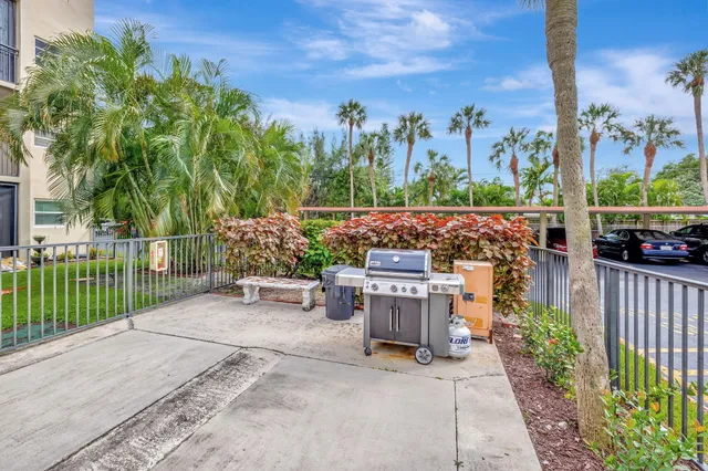 a view of a patio with a table and chairs