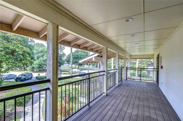 a view of a porch with wooden floor