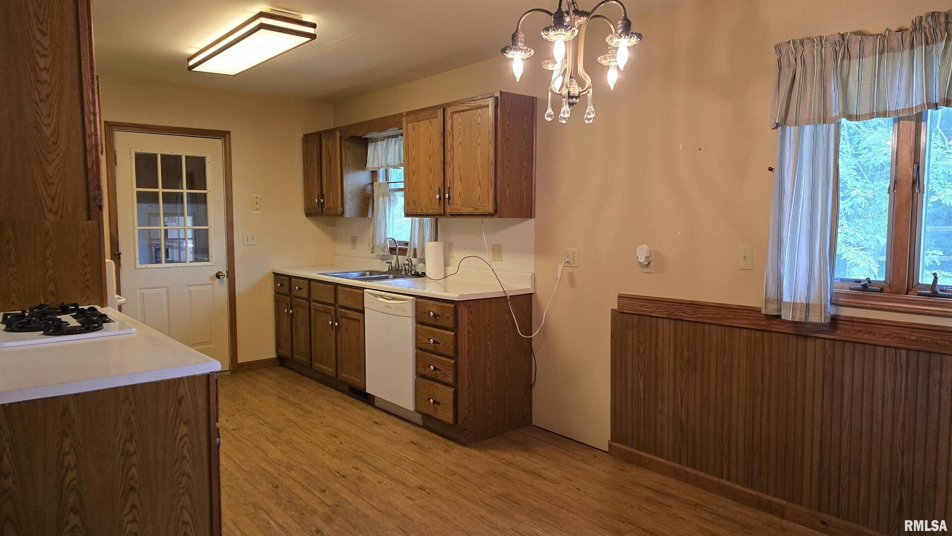 400 Old Broughton Road Eldorado, IL 62930 - Photo 11 of 28 a kitchen with a sink cabinets and wooden floor