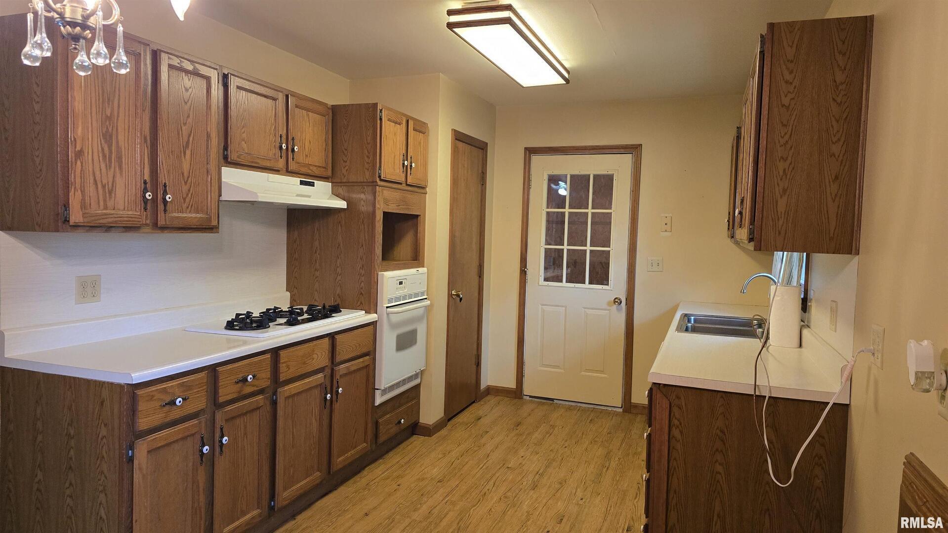 400 Old Broughton Road Eldorado, IL 62930 - Photo 12 of 28 a kitchen with stainless steel appliances a refrigerator and a sink