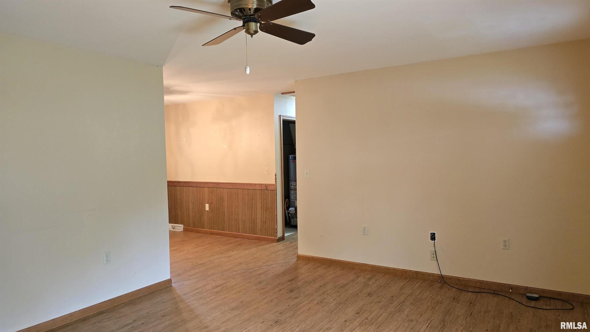 400 Old Broughton Road Eldorado, IL 62930 - Photo 10 of 28 an empty room with wooden floor fan and windows
