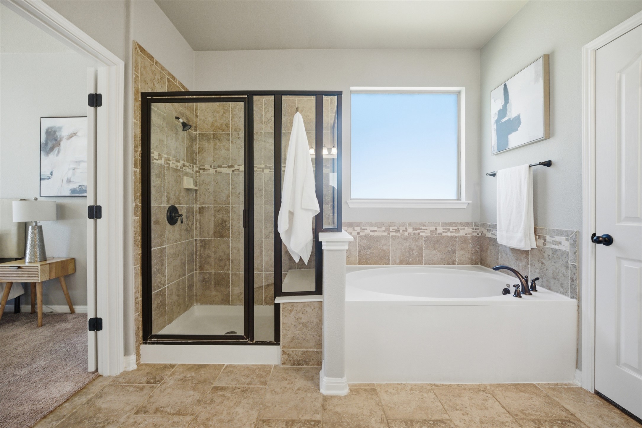 16100 Spillman Ranch Loop Austin, TX 78738 - Photo 26 of 39 a white bath tub sitting next to a bathroom