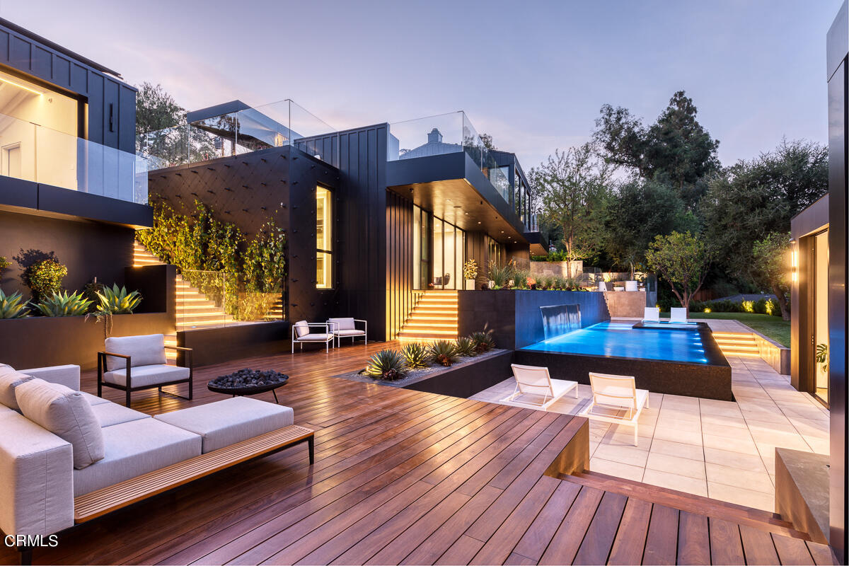 a view of a living room and a wooden deck