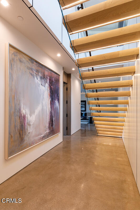Undisclosed Address Pasadena, CA 91103 - Photo 13 of 74 a view of an empty room with stairs and a painting on the wall