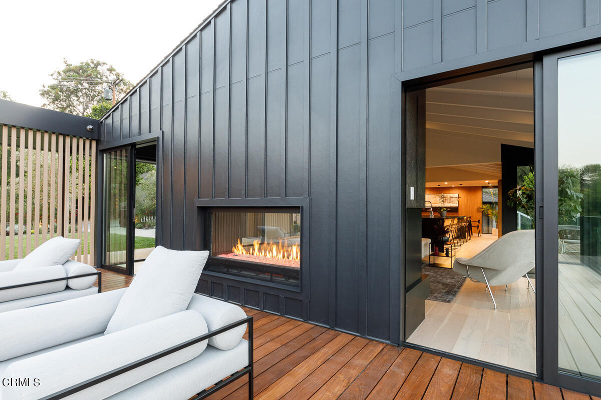 Undisclosed Address Pasadena, CA 91103 - Photo 26 of 74 a living room with furniture wooden floor and a fireplace