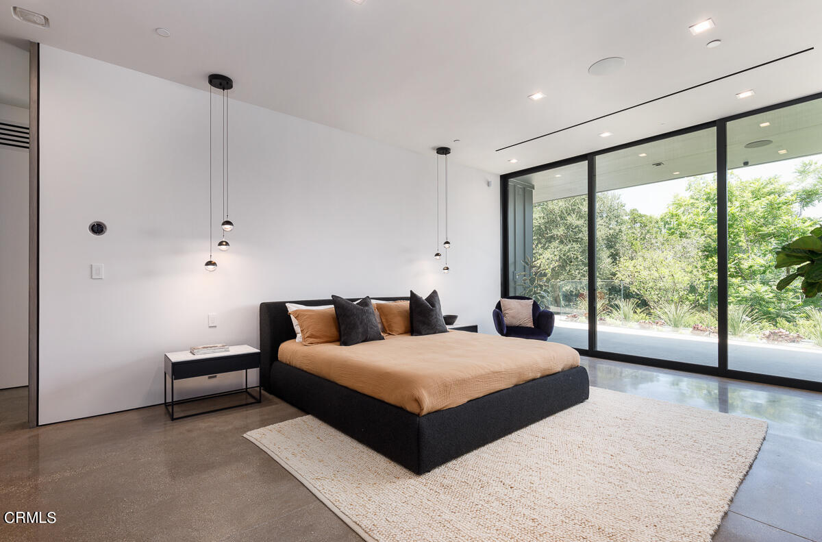 Undisclosed Address Pasadena, CA 91103 - Photo 27 of 74 a bedroom with a large bed and a large window