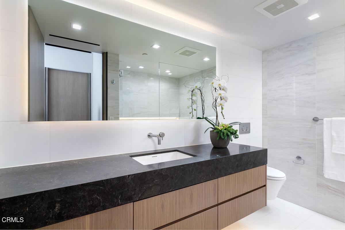 Undisclosed Address Pasadena, CA 91103 - Photo 34 of 74 a bathroom with a sink and a mirror