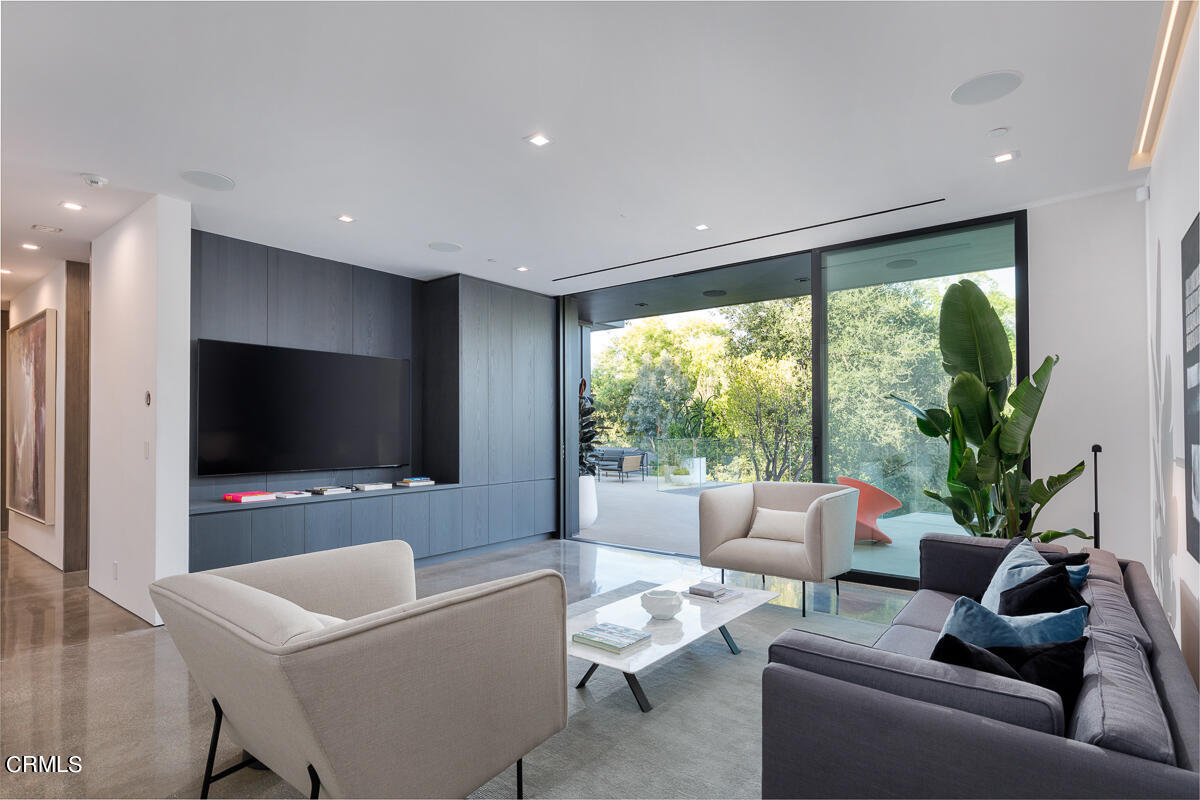Undisclosed Address Pasadena, CA 91103 - Photo 36 of 74 a living room with furniture and a flat screen tv