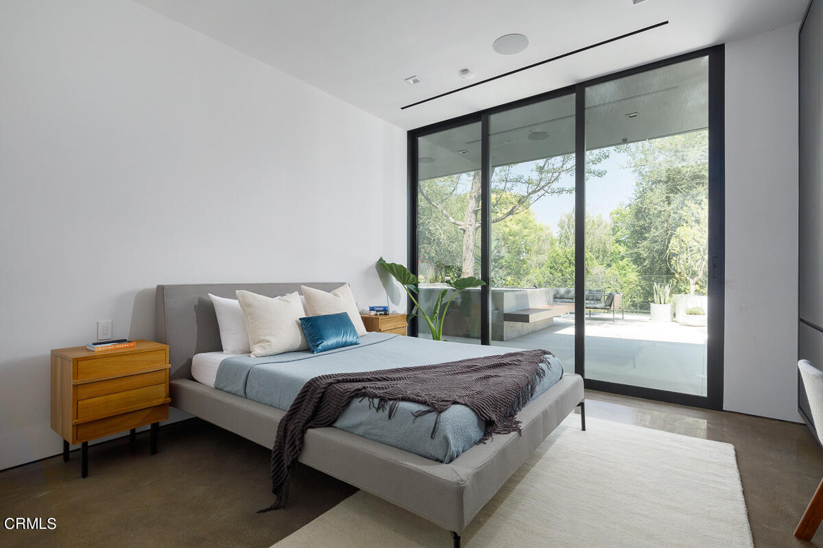 Undisclosed Address Pasadena, CA 91103 - Photo 39 of 74 a bedroom with a bed and a large window