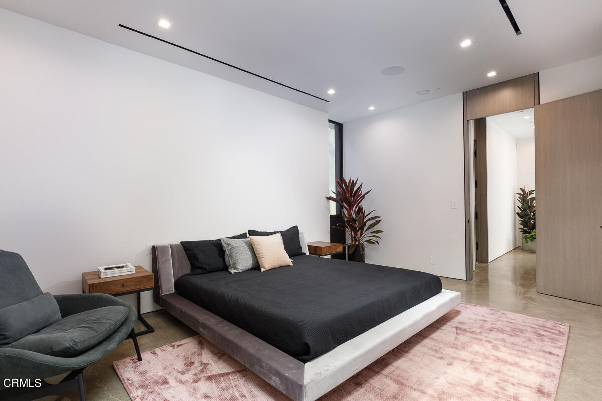 Undisclosed Address Pasadena, CA 91103 - Photo 40 of 74 a bedroom with a bed and wooden floor