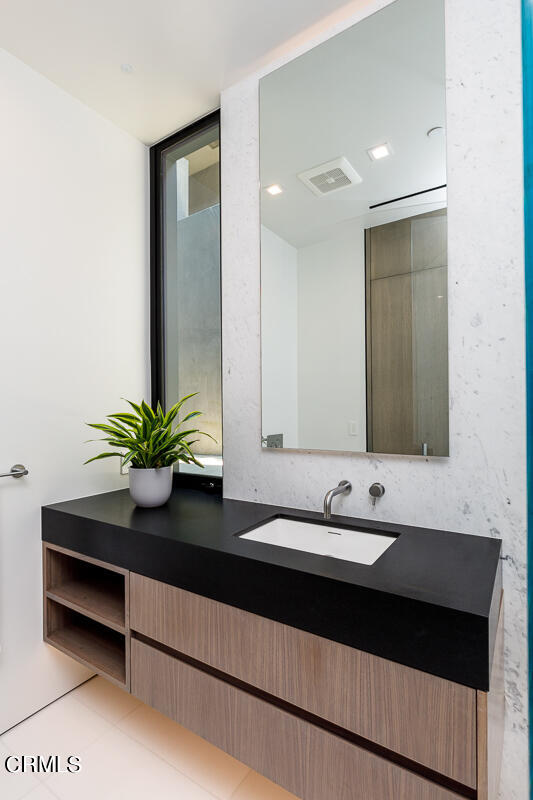 Undisclosed Address Pasadena, CA 91103 - Photo 44 of 74 a bathroom with a sink a vanity and a mirror