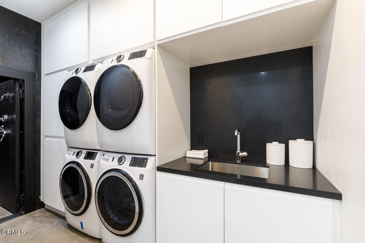 Undisclosed Address Pasadena, CA 91103 - Photo 45 of 74 a view of a hallway with washer and dryer
