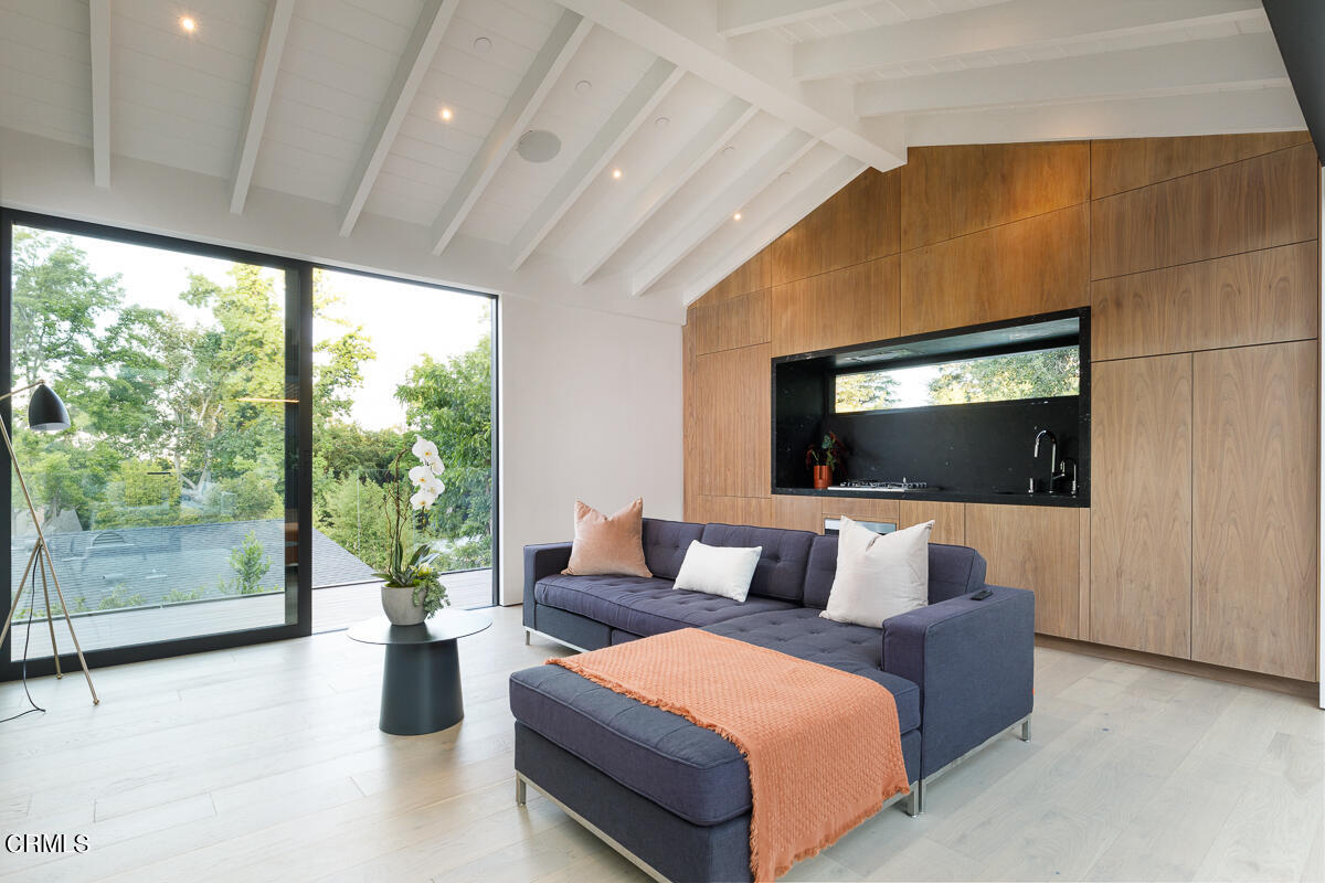 Undisclosed Address Pasadena, CA 91103 - Photo 52 of 74 a living room with furniture and a flat screen tv