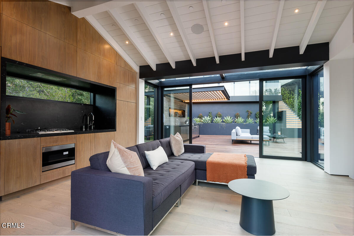 Undisclosed Address Pasadena, CA 91103 - Photo 57 of 74 a living room with patio furniture and a flat screen tv