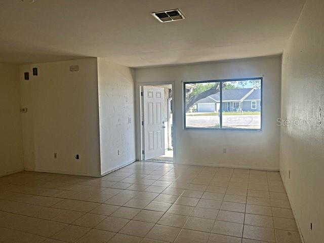 12 Pine Course Way Ocala, FL 34472 - Photo 7 of 29 a view of an empty room with a window