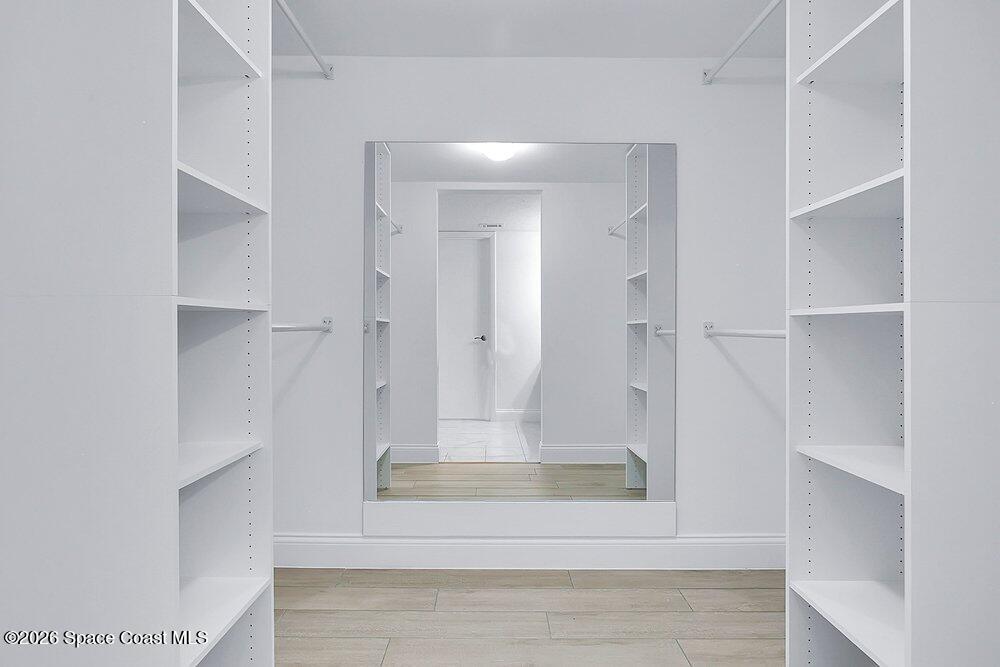 325 Tangle Run Boulevard, Unit 1113 Melbourne, FL 32940 - Photo 19 of 28 Primary bedroom walk-in closet