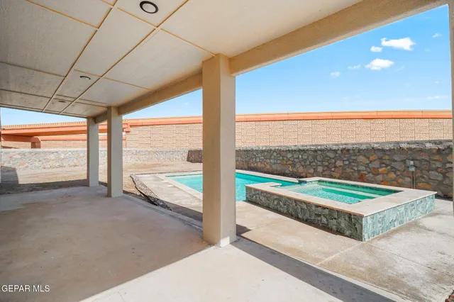 a view of a large room with a floor to ceiling window and an outdoor view