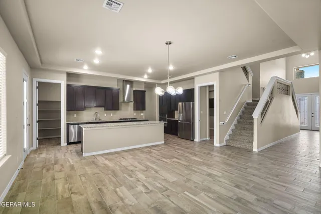 a view of kitchen with cabinets and window