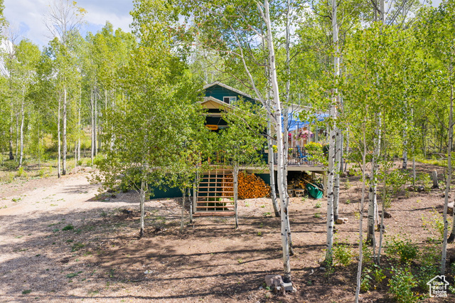 714 Spotted Fawn Way Kamas, UT 84036 - Photo 3 of 34 Rear view of house with stairway and a wooden deck