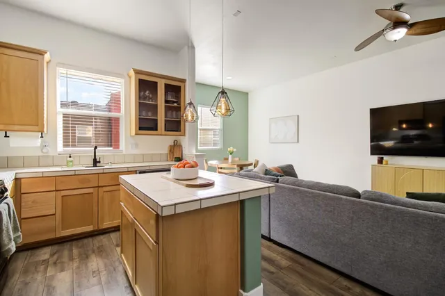 a kitchen with a sink stove and microwave