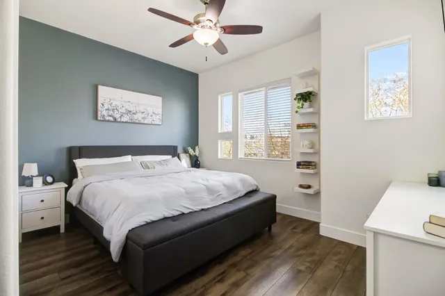 a bed room with a bed and a window