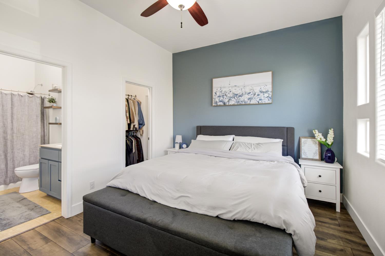 10890 Disk Drive Rancho Cordova, CA 95670 - Photo 23 of 43 a bedroom with a large bed and a chandelier