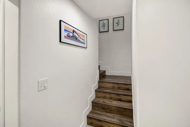 a view of a hallway with stairs