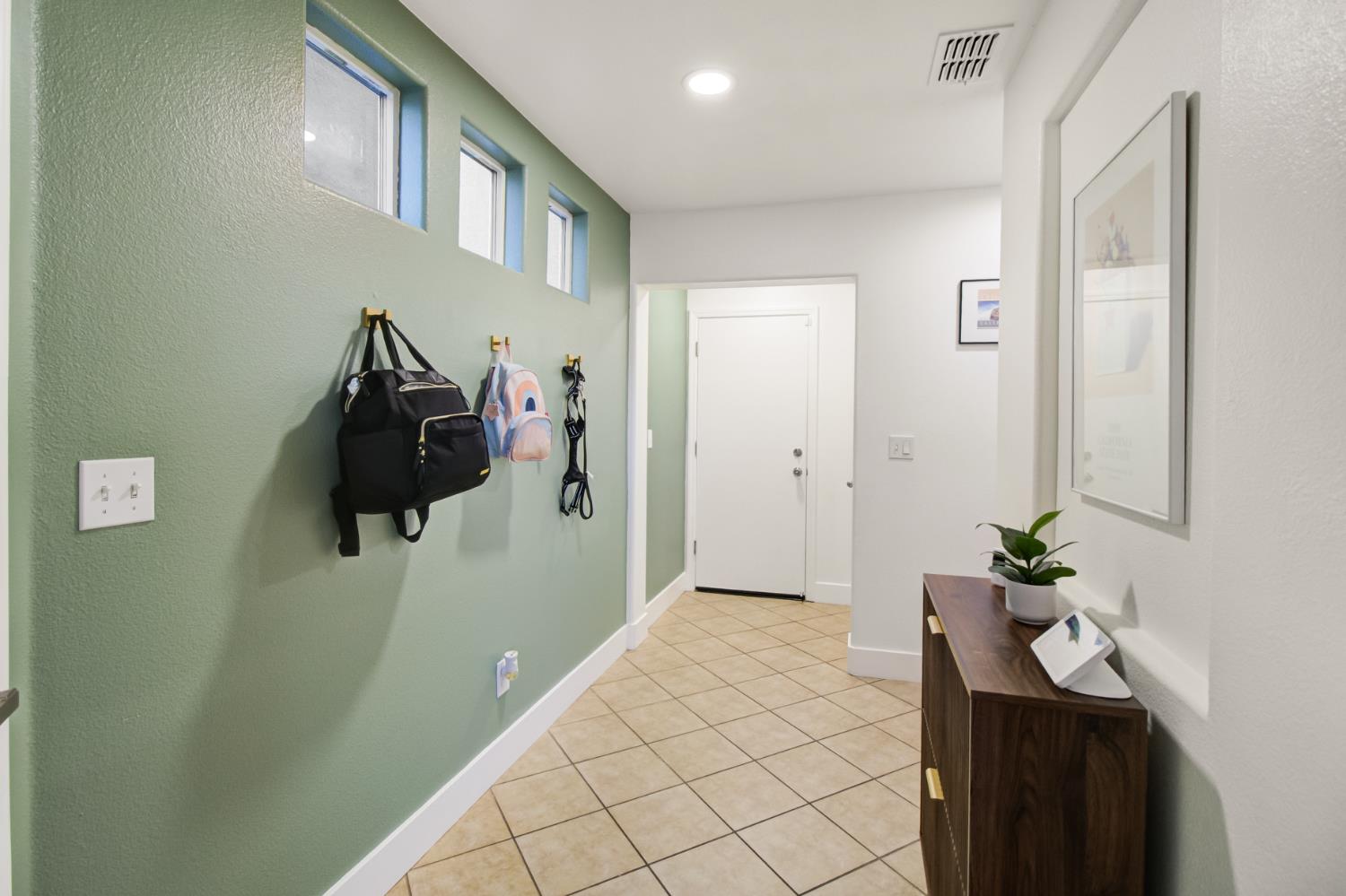 10890 Disk Drive Rancho Cordova, CA 95670 - Photo 30 of 43 a hallway with white walls and wooden floor