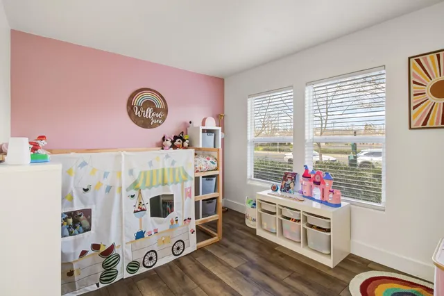 a bedroom with furniture and a window
