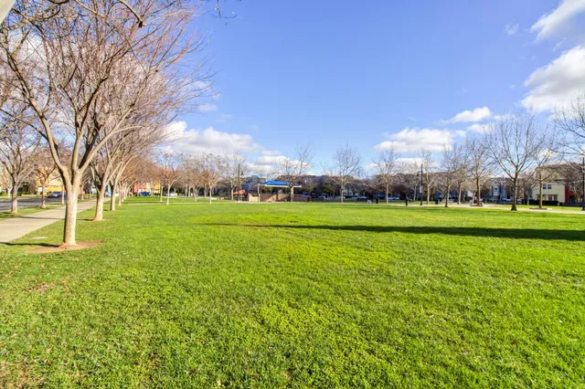 a building view with cars parked in front of it