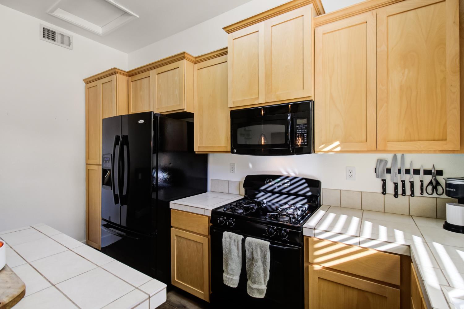 10890 Disk Drive Rancho Cordova, CA 95670 - Photo 10 of 43 a kitchen with a sink and a refrigerator