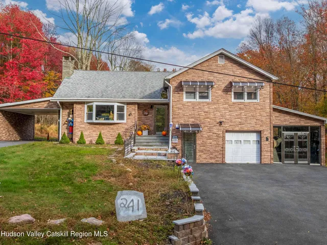 a view of outdoor seating and covered with large trees